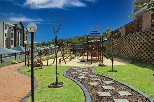 a park with a playground with at The Sanctuary Sleek Smart Space in Johannesburg