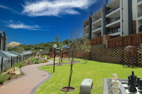 a park in front of a building at The Sanctuary Sleek Smart Space in Johannesburg