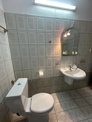 a bathroom with a toilet and a sink at Veaki Beach House in Xanthi