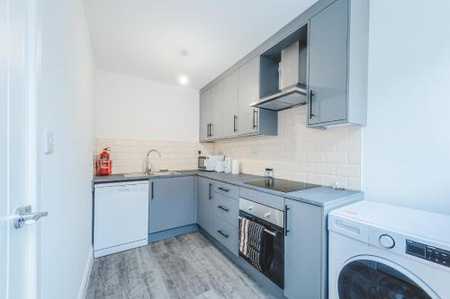 Η κουζίνα ή μικρή κουζίνα στο The Regent Circus Apartments