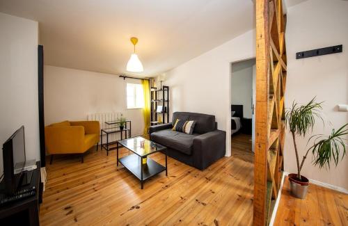 a living room with a couch and a table at Casa Moniz - 4 floor in Lisbon