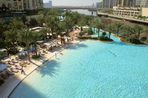 an aerial view of a large swimming pool at a resort at Knokey Dubai Creek Beach with Lagoon Pool access in Dubai