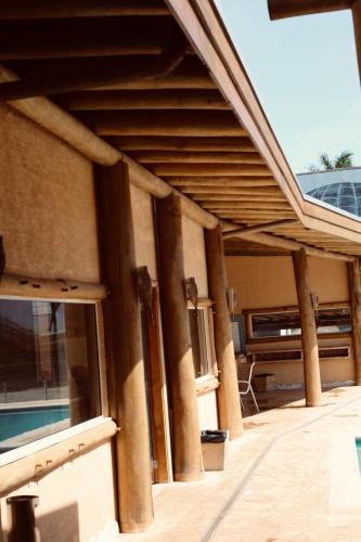 a building with columns on the side of it at Meu Hotel Boituva in Boituva