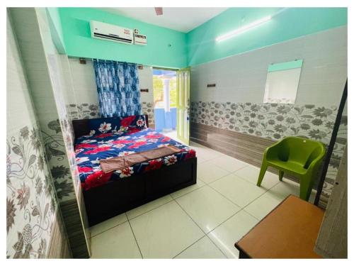Ein Bett oder Betten in einem Zimmer der Unterkunft Udhayam Residency
