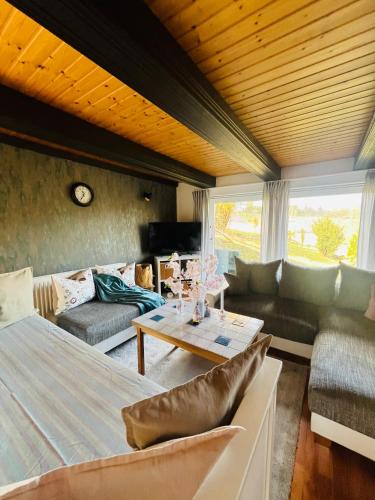 a living room with a couch and a table at Ferienwohnung „Am Gnaucks Hutberg“ in Hohnstein