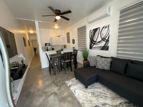 a living room with a couch and a dining room at El Amanecer del Este 3 in Fajardo