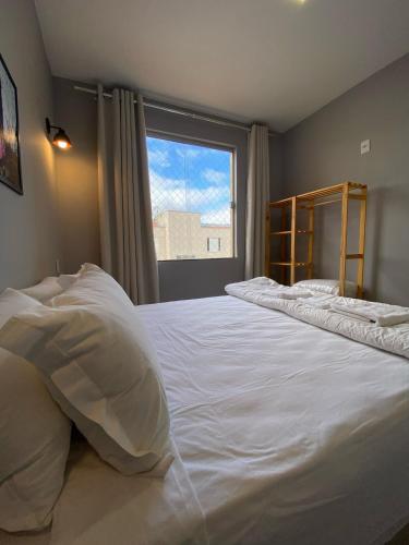 En eller flere senge i et værelse på Apto 2 ao lado da UFOP e garagem