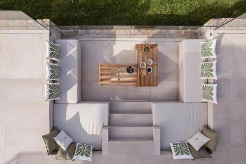 an overhead view of a patio with stairs and pillows at JK's 4 in Vamos