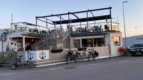 a restaurant with two bikes parked outside of it at Forest Seaside living in Vallda Kattegatt trail in Vallda