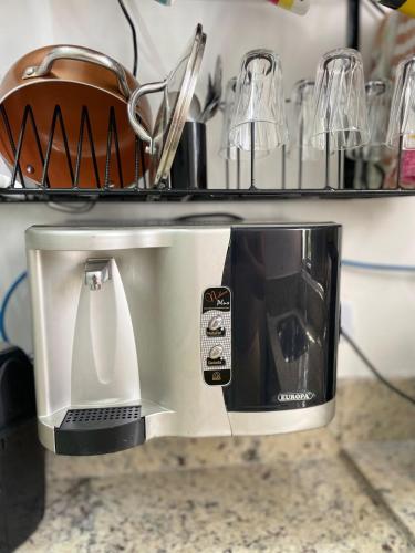 a coffee maker sitting on top of a counter at Casa em Barueri in Barueri