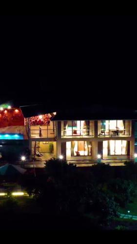 a lit up building at night with lights at Tulsi Villa in Panchgani