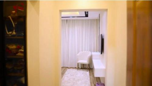 a room with a desk and a chair and a window at Fully furnished Townhouse in Abū Rawwāsh