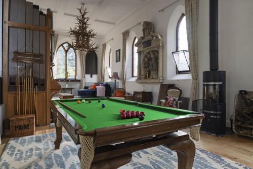 a room with a pool table with balls on it at The Old Church in Ringwood