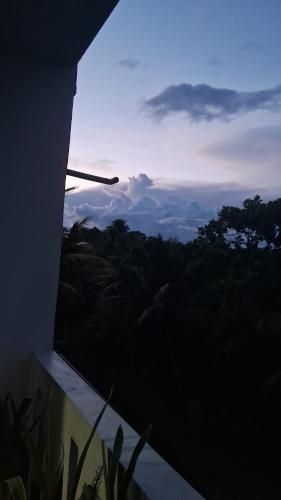 a view of the mountains from a window of a house at RKO Villa27 - Unawatuna in Habaraduwa