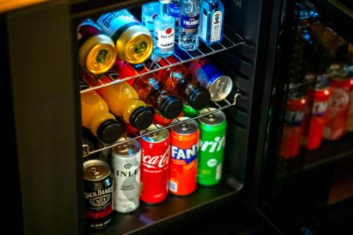 a refrigerator filled with lots of different types of drinks at Hotel NOBILIS - Mladá Boleslav in Bradlec