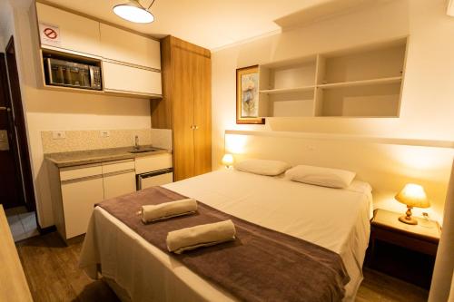 En eller flere senge i et værelse på Hotel Golden Star