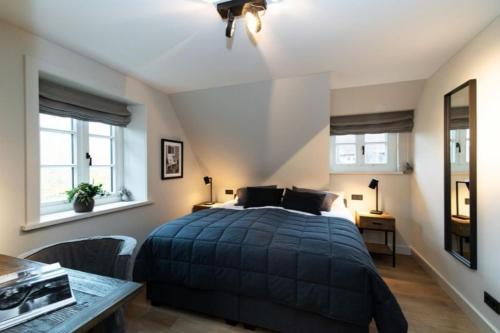 En eller flere senge i et værelse på Hausteil Üüs Droom Hüs, Tinnum, Sylt