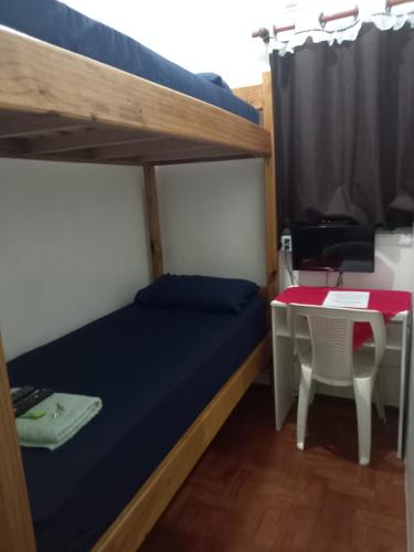 Ένα ή περισσότερα κρεβάτια σε δωμάτιο στο Quartos no centro de Itu - Hospedagem Elizabeth