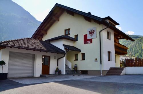 a hotel in the mountains with a garage at Ferienhaus Tirol im Ötztal in Umhausen