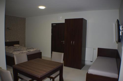 Una cama o camas en una habitación de Vila Lexus