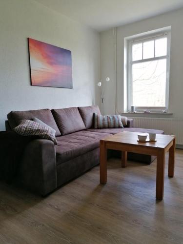 a living room with a couch and a coffee table at FW Einfeldt in Hinrichsdorf