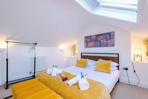 a bedroom with two beds with towels on them at Stylish 3-Bed City Centre Home in Chester by 53 Degrees Property, Ideal for Groups, Private Parking! in Chester