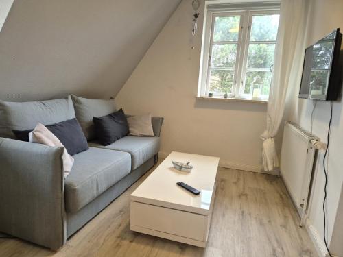 a living room with a couch and a table at Ferienwohnung Goting Nr.3 in Goting