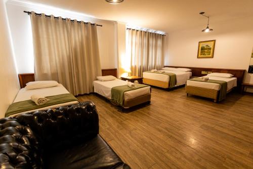 En eller flere senge i et værelse på Hotel Golden Star