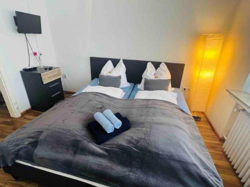 a large bed with two white pillows on it at Nordsee Apartment in Hagen