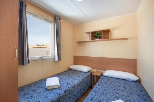 Postel nebo postele na pokoji v ubytování El Olivo 2