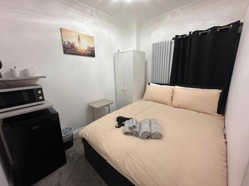 Ένα ή περισσότερα κρεβάτια σε δωμάτιο στο London Borough 5 min walk