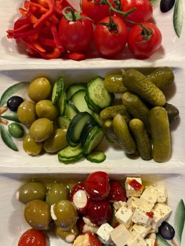 a refrigerator filled with different types of vegetables at Aparthotel Garni Monte in Kartitsch