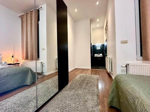 Ένα ή περισσότερα κρεβάτια σε δωμάτιο στο Luxury Suites Centrum by Rikas Hotels