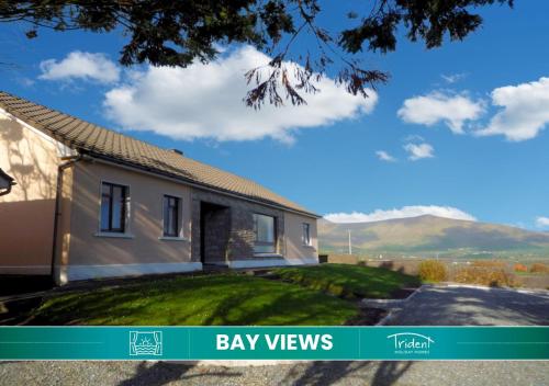 a house with a view of the mountains at Dingle Bay View by Trident Holiday Homes in Dingle