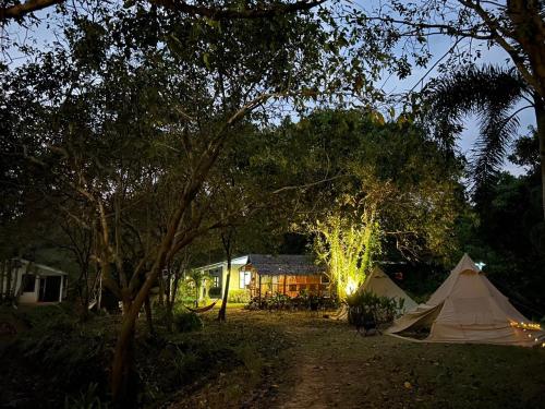 a tent in front of a house at night at The River Retreat Koh Mak in Ko Mak