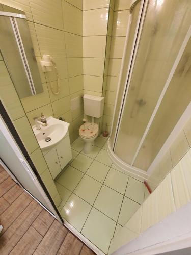 a small bathroom with a shower and a toilet at ChicStudio feel at home in Galaţi