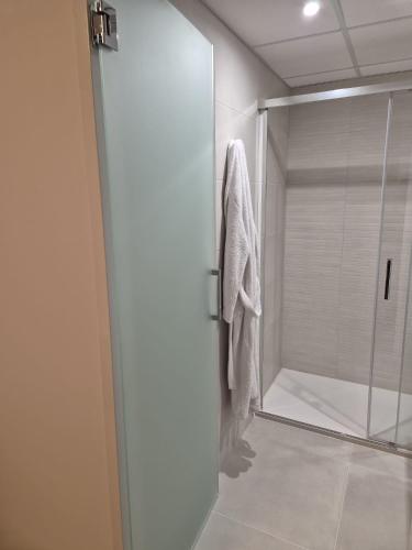 a bathroom with a shower with a glass door at Hotel Calella by Beatriz Hoteles in Calella