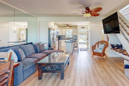 a living room with a couch and a table at Puamana 30-2 in Lahaina