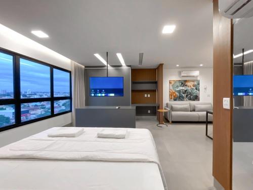 Postel nebo postele na pokoji v ubytování Flat Moderno e Amplo ao Lado do Shopping CG
