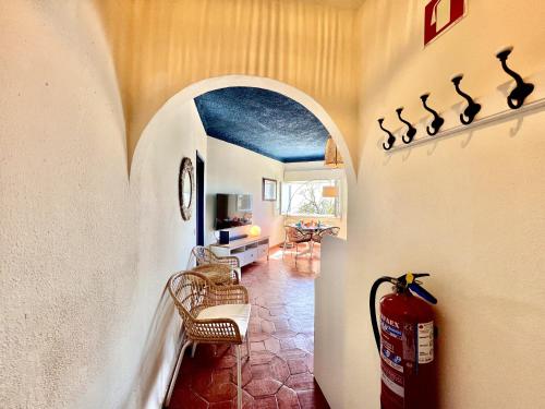 a hallway with a room with a fire hydrant and a living room at Lagos Ocean Breeze 2 by Homing in Lagos