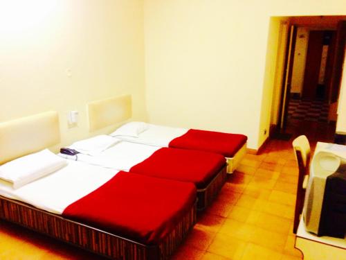 Hotel Ranjit Residencyにあるベッド