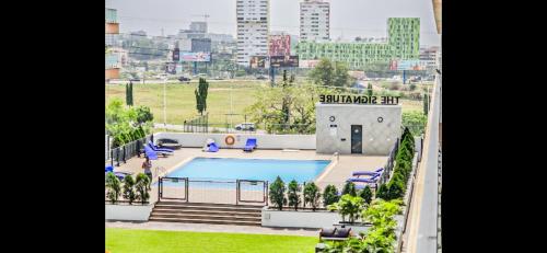 a view of the pool at the signature apartment at The Signature Hotel Apartment Accra Ghana in Accra