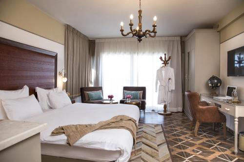 TV a/nebo společenská místnost v ubytování Shtarkman Erna Boutique Hotel Nahariya