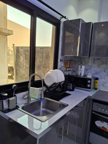 Dapur atau dapur kecil di Seckebe Immo Et Business Studio Gris