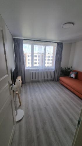 Ένα ή περισσότερα κρεβάτια σε δωμάτιο στο Tiny cozy apartment 'Unihus'