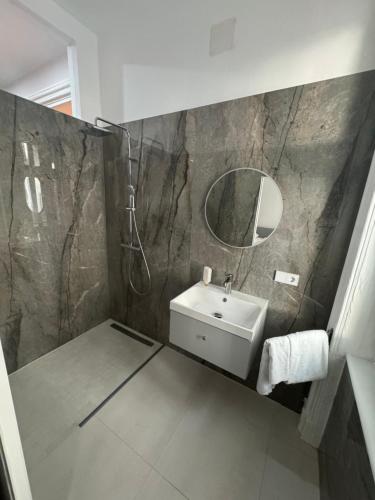 a bathroom with a sink and a mirror at Notorious Design Apartments - near Kärntner Straße in Vienna