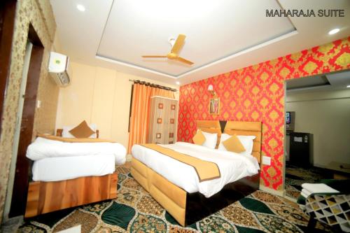 a hotel room with two beds in a room at The Tulsi Garden - Ashram vihar vrindavan in Vrindāvan