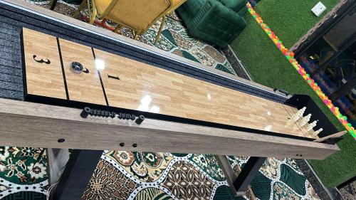 an overhead view of a wooden bench on a floor at The Tulsi Garden - Ashram vihar vrindavan in Vrindāvan