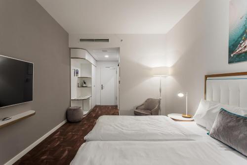 Cama o camas de una habitación en Mercure Hotel MOA Berlin