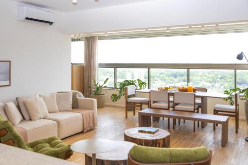 a living room with a couch and a table at White 2880 - Pinheiros in Sao Paulo
